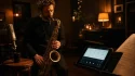 Jazz saxophonist playing a saxophone beside a tablet displaying sheet music in a dimly lit club around a microphone and warm lighting.